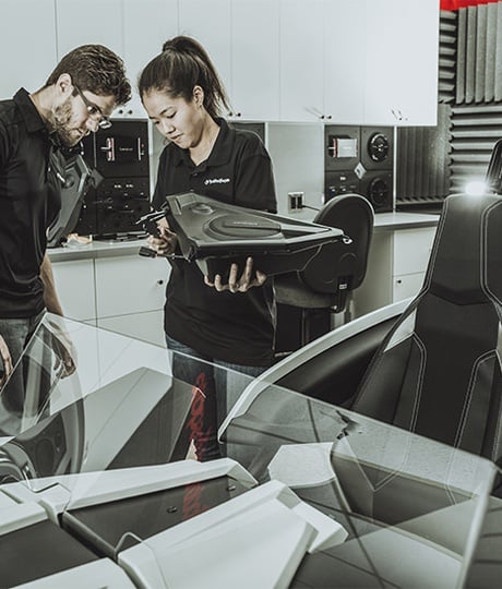 Rockford Fosgate engineers measuring a Polaris Slingshot door pod with speaker